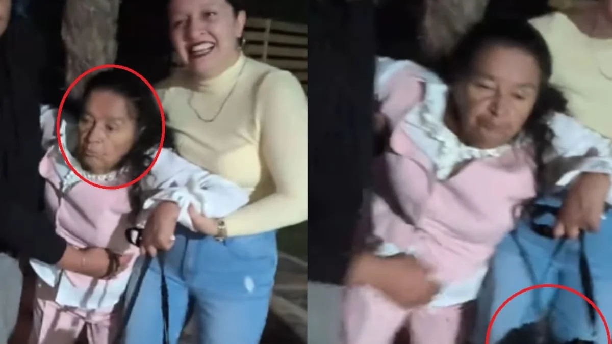 Mujer de 80 años sostenida por sus familiares mientras conserva su cartera