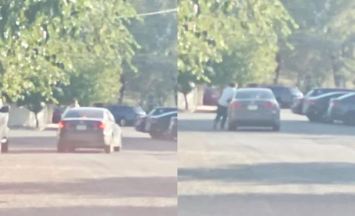 Hombre junto a un vehículo durante incidente en el fraccionamiento Sicomoros