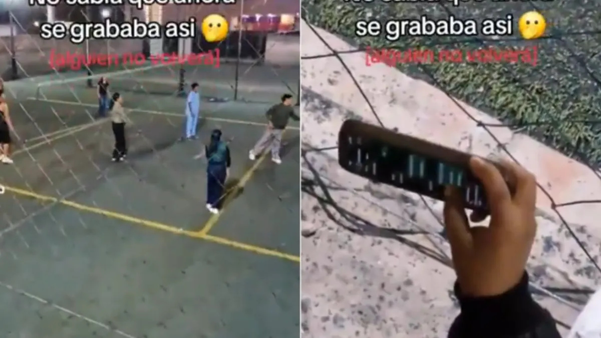 Mujer revisa chats en un teléfono durante un partido