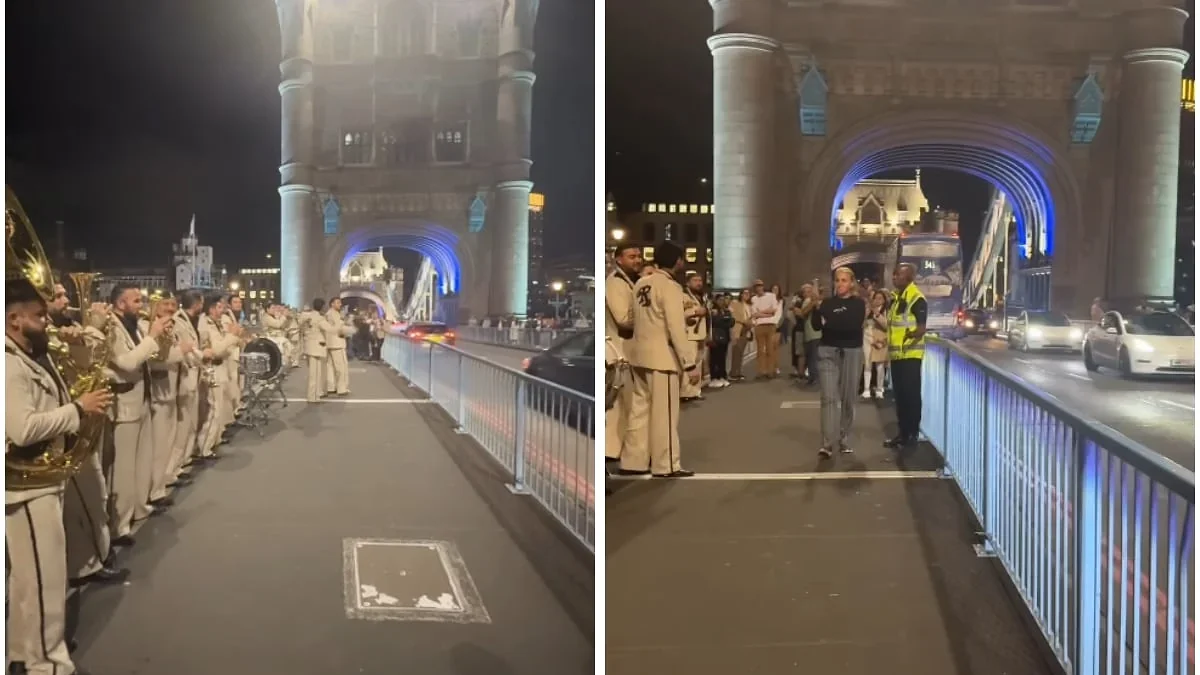 Banda El Recodo toca cerca del Tower Bridge antes de ser retirada por un agente