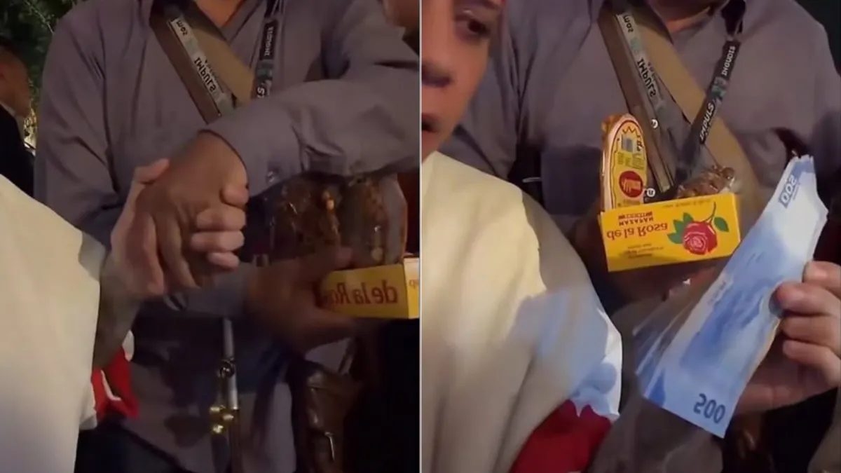 Santa Fe Klan entrega dinero a un vendedor de mazapanes con discapacidad visual